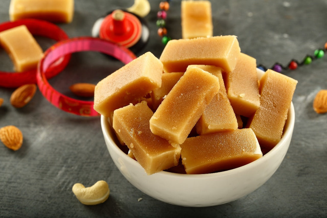 Mysore Pak Made by Lynk Foods is kept in the bowl placed on a decorative table with some of the dry fruits.
